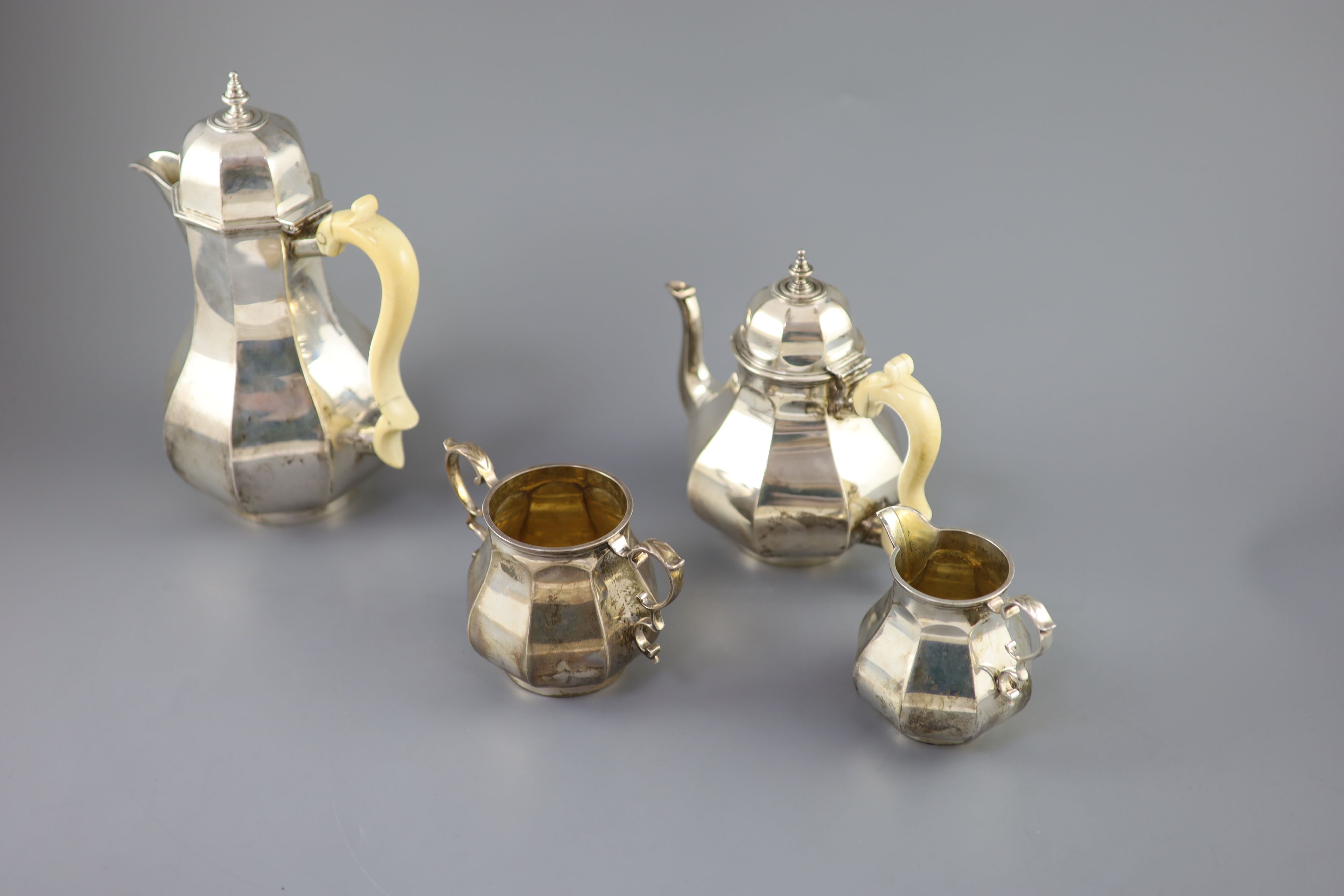 A late Victorian silver four piece Queen Anne style octagonal tea service by Elkington & Co,